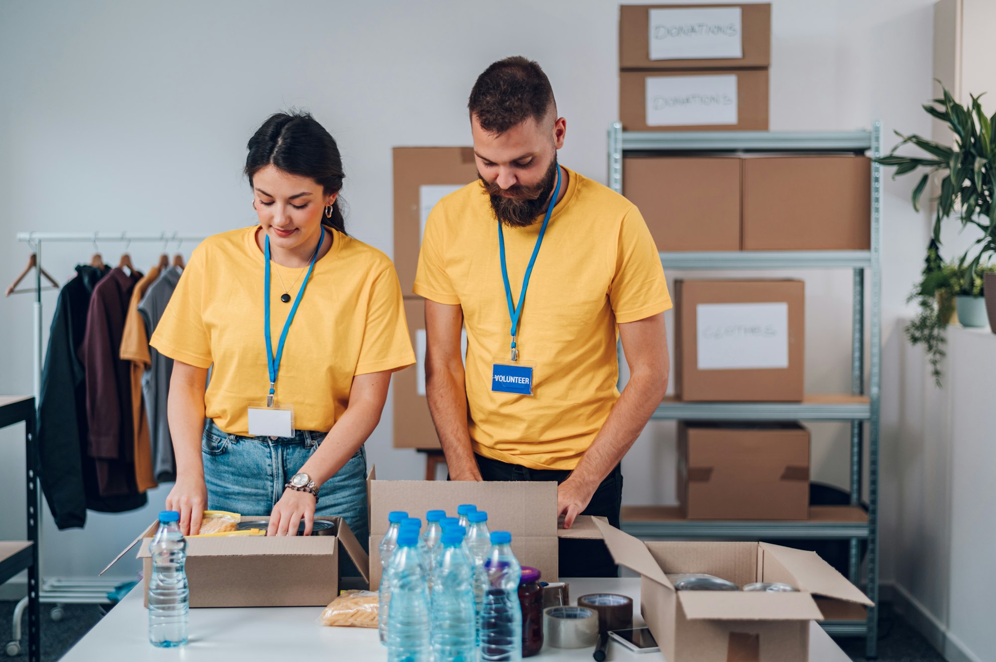 Group of volunteers working in community charity donation center